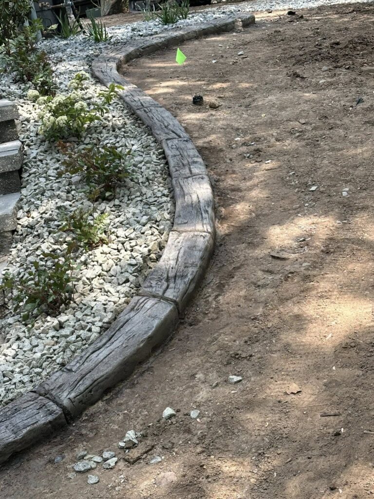 concrete curbing in wood grain hand hewn stamp
