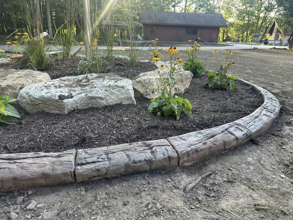 concrete curbing in hand hewn wood grain stamp