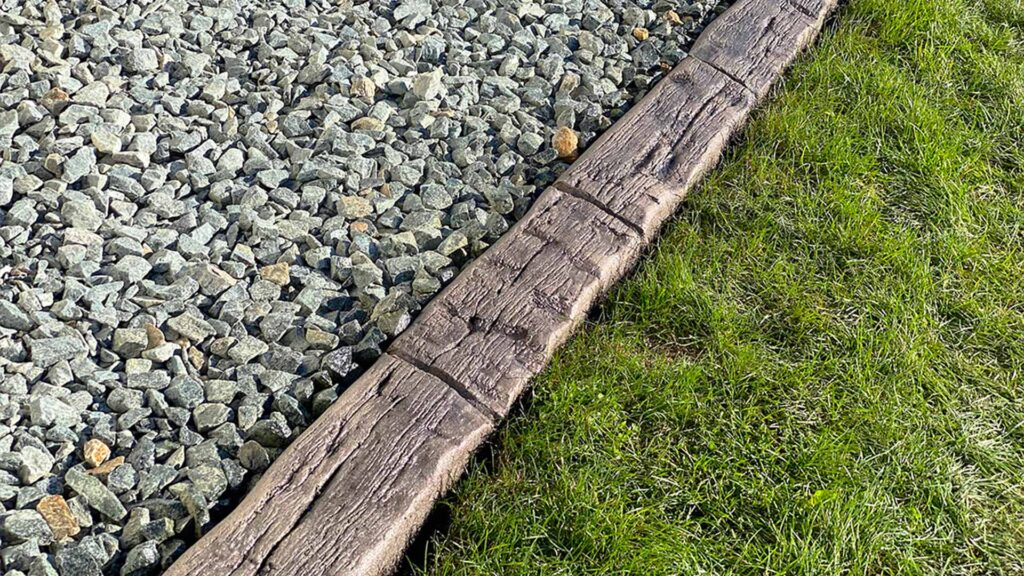 concrete curbing in wood grain hand hewn